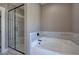 Modern bathroom featuring a stand-up shower and soaking tub with tile surround at 30 Grand Georgian Ne Ct, Cartersville, GA 30121