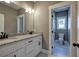 Bathroom showcases granite countertops, double sinks, and a view of the toilet and window at 30 Grand Georgian Ne Ct, Cartersville, GA 30121