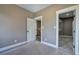 Bedroom featuring neutral walls, and multiple doorways and a closet at 30 Grand Georgian Ne Ct, Cartersville, GA 30121