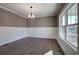 Dining room with hardwood floors, chandelier, and large windows at 30 Grand Georgian Ne Ct, Cartersville, GA 30121