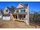 Charming two-story home with stone accents, a two-car garage, and black window trim at 30 Grand Georgian Ne Ct, Cartersville, GA 30121