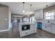 Open kitchen with island, stainless steel appliances, granite countertops, and view of living room at 30 Grand Georgian Ne Ct, Cartersville, GA 30121