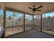 Inviting screened-in porch with wood flooring, black railings, and natural views at 30 Grand Georgian Ne Ct, Cartersville, GA 30121