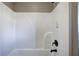 All-white shower tub features a curved, easy-to-clean design and a sleek black faucet at 30 Grand Georgian Ne Ct, Cartersville, GA 30121