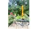 Serene backyard patio surrounded by lush greenery, featuring an outdoor table and seating for peaceful relaxation at 4237 Webb Meadows Dr, Loganville, GA 30052
