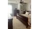 Bedroom featuring light carpet, wood furniture, and a queen bed at 4237 Webb Meadows Dr, Loganville, GA 30052