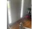 Entryway with a white door, sidelights, hardwood floor, and indoor plants for a welcoming atmosphere at 4237 Webb Meadows Dr, Loganville, GA 30052