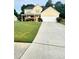 Charming two-story home with a well-manicured lawn and a spacious driveway at 4237 Webb Meadows Dr, Loganville, GA 30052