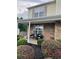 Inviting front porch with stone accents, lush landscaping, and seating area perfect for relaxation and curb appeal at 4237 Webb Meadows Dr, Loganville, GA 30052