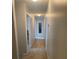 Neutral hallway with carpet and doors leading to other rooms at 4237 Webb Meadows Dr, Loganville, GA 30052