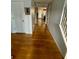 Bright hallway with hardwood floors leading to other rooms at 4237 Webb Meadows Dr, Loganville, GA 30052