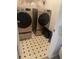 Laundry room featuring a side-by-side washer and dryer, with an eye-catching tile pattern on the floor at 4237 Webb Meadows Dr, Loganville, GA 30052