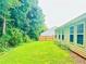 Spacious, grassy back yard surrounded by lush trees offers privacy at 6214 Treeridge Nw Dr, Acworth, GA 30101