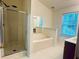 Bathroom features separate shower and tub, window and double vanity at 6214 Treeridge Nw Dr, Acworth, GA 30101