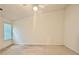 Bedroom features a ceiling fan and large window at 6214 Treeridge Nw Dr, Acworth, GA 30101
