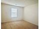 Simple bedroom with carpet flooring and natural light from a window at 6214 Treeridge Nw Dr, Acworth, GA 30101