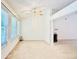 A well-lit living room features large windows and fireplace at 6214 Treeridge Nw Dr, Acworth, GA 30101