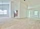 Open-concept living area with kitchen view, chandelier, and abundant natural light at 6214 Treeridge Nw Dr, Acworth, GA 30101