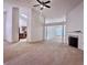 Spacious living room with fireplace, view to the kitchen, and neutral carpet at 6214 Treeridge Nw Dr, Acworth, GA 30101