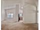 Open living room featuring neutral carpet, high ceilings, and view to the kitchen at 6214 Treeridge Nw Dr, Acworth, GA 30101