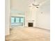 Bright living room with fireplace, and decorative columns leading to another room at 6214 Treeridge Nw Dr, Acworth, GA 30101