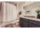 Bathroom features a granite countertop and a shower with white curtain at 2433 Santa Rosa St, Alpharetta, GA 30009