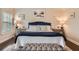 Comfortable primary bedroom suite showcases a plush bed and a decorative headboard at 2433 Santa Rosa St, Alpharetta, GA 30009