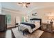 Primary bedroom suite features a plush bed, tray ceilings, and neutral decor at 2433 Santa Rosa St, Alpharetta, GA 30009