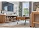 Relaxing living room highlighting neutral tones, large window, shelving and modern furnishings for comfort at 2903 Sunrise Ridge Rd, Snellville, GA 30078