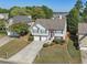 Two-story home features a two-car garage, well-maintained lawn and bushes, and a brick facade at 3709 Mcguire Nw St, Kennesaw, GA 30144