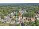 An aerial view showing home nestled in a lush, green neighborhood with mature trees and well-maintained homes at 3709 Mcguire Nw St, Kennesaw, GA 30144