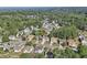 An aerial view showing the home nestled in a lush, green neighborhood with mature trees and well-maintained lawns at 3709 Mcguire Nw St, Kennesaw, GA 30144