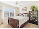 Bedroom featuring large window, plush carpet, and furniture accents including sleek black bookshelf at 3709 Mcguire Nw St, Kennesaw, GA 30144