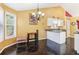Cozy breakfast nook area with large windows, chandelier, and kitchen access at 3709 Mcguire Nw St, Kennesaw, GA 30144