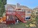 Back of a home with a two-level deck in the backyard at 3709 Mcguire Nw St, Kennesaw, GA 30144