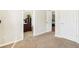 Hallway with access to bedrooms and neutral carpeting at 3709 Mcguire Nw St, Kennesaw, GA 30144