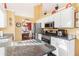 Bright kitchen featuring granite countertops, stainless steel appliances, and views into the dining area at 3709 Mcguire Nw St, Kennesaw, GA 30144