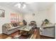 Cozy living room featuring neutral walls, plush furniture, and a large window at 3709 Mcguire Nw St, Kennesaw, GA 30144