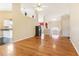 Spacious living area with open floor plan, hardwood floors, and staircase in the background at 3709 Mcguire Nw St, Kennesaw, GA 30144