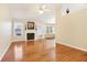 Open living space with fireplace, hardwood floors, and large windows for ample natural light at 3709 Mcguire Nw St, Kennesaw, GA 30144