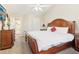 Bedroom features a wooden bed, dresser, and TV at 3709 Mcguire Nw St, Kennesaw, GA 30144