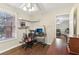 A well-lit office with hardwood flooring and a computer setup, plus another room at 3709 Mcguire Nw St, Kennesaw, GA 30144