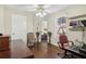 A well-lit office with a computer setup and hardwood flooring at 3709 Mcguire Nw St, Kennesaw, GA 30144