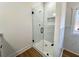 Modern bathroom showcasing a frameless glass shower with tile surround and sleek black fixtures at 6149 Pinewood Se Dr, Covington, GA 30014