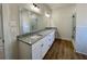 Elegant bathroom with a double vanity, granite countertop, and a spacious glass-enclosed shower at 6149 Pinewood Se Dr, Covington, GA 30014