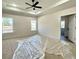 Bright bedroom with large windows, recessed lighting, and a ceiling fan at 6149 Pinewood Se Dr, Covington, GA 30014