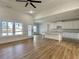 Open-concept kitchen featuring a center island, white cabinets, and bright natural light at 6149 Pinewood Se Dr, Covington, GA 30014