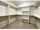 Spacious walk-in closet with custom shelving, providing ample storage and organization solutions at 6149 Pinewood Se Dr, Covington, GA 30014