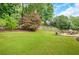 Expansive backyard featuring a stone patio with outdoor seating and a built-in grill for outdoor entertaining at 1473 Cardova Pointe, Dunwoody, GA 30338