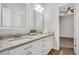 Bathroom features double sinks, granite countertop, and white cabinets at 1473 Cardova Pointe, Dunwoody, GA 30338